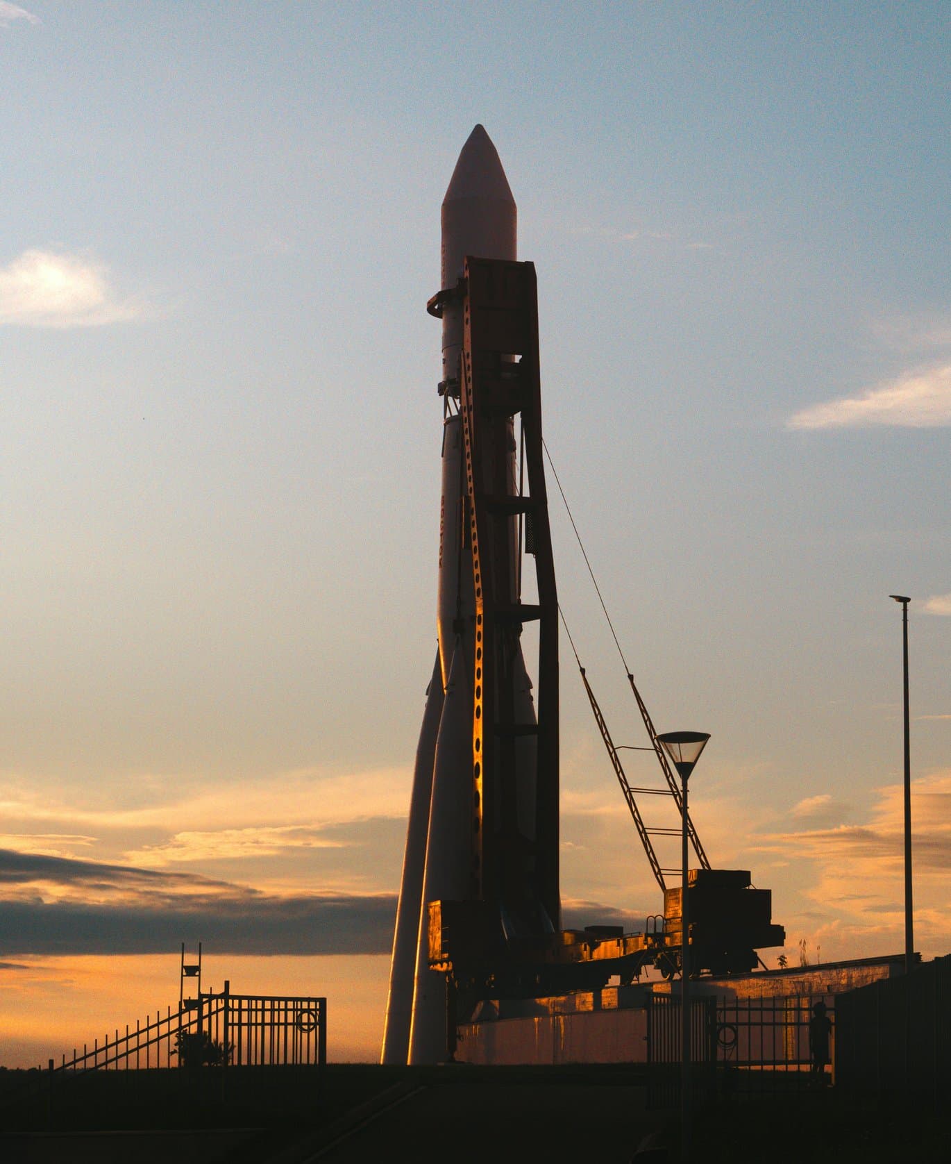 Rocket on its launch gantry at sunset